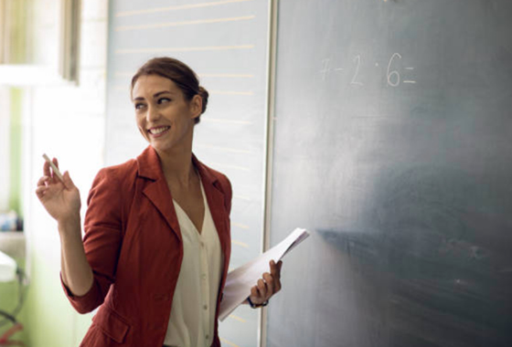 Woman taking notes on a chalkboard