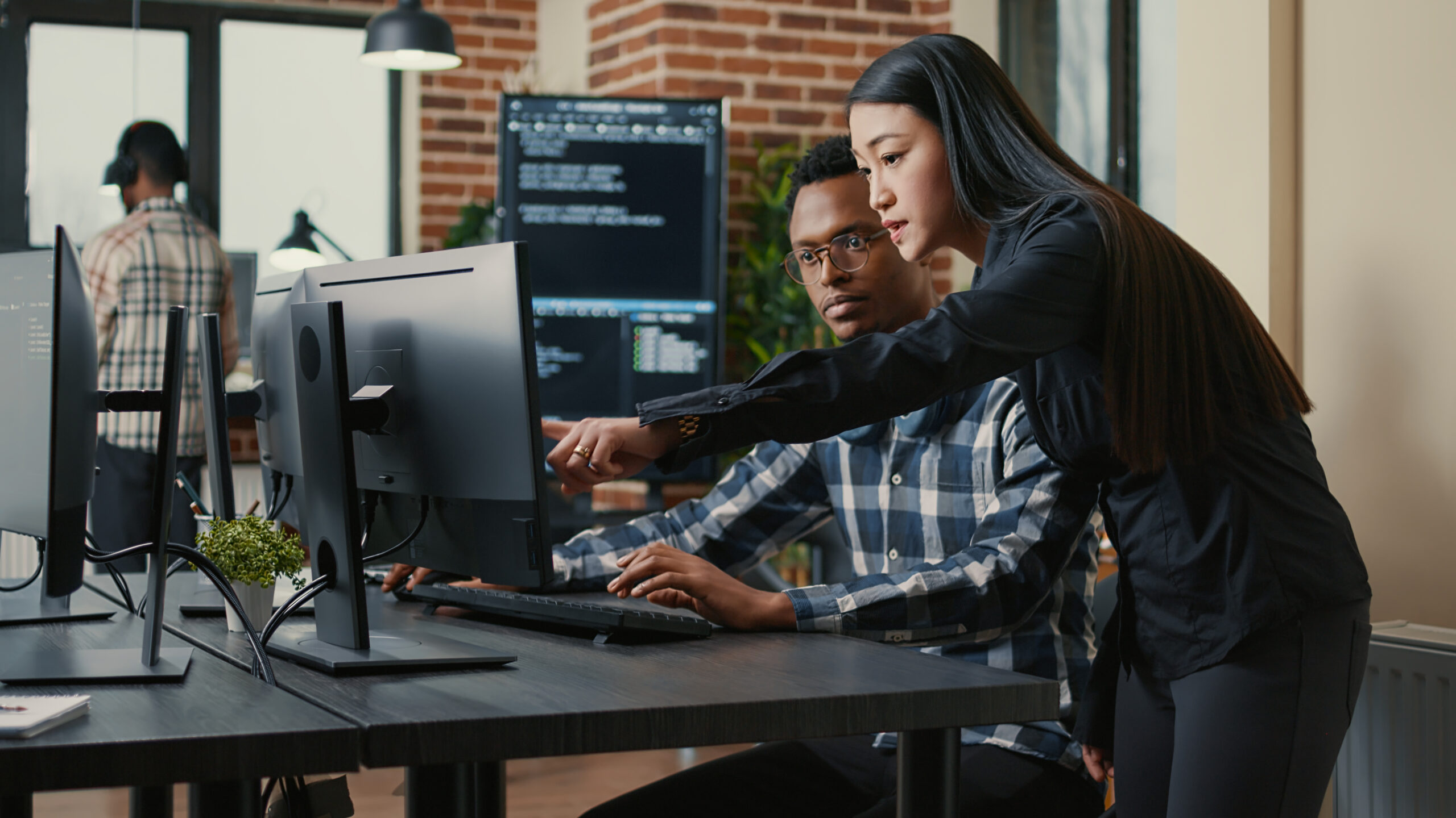 Co-workers working together on a technology project